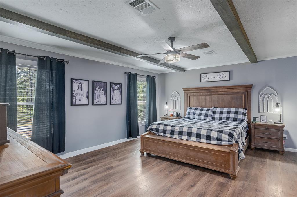 339 Cycle Plant Road Benton, LA 71006 - Photo 12 of 25 a bedroom with a bed next to a window with the outer view