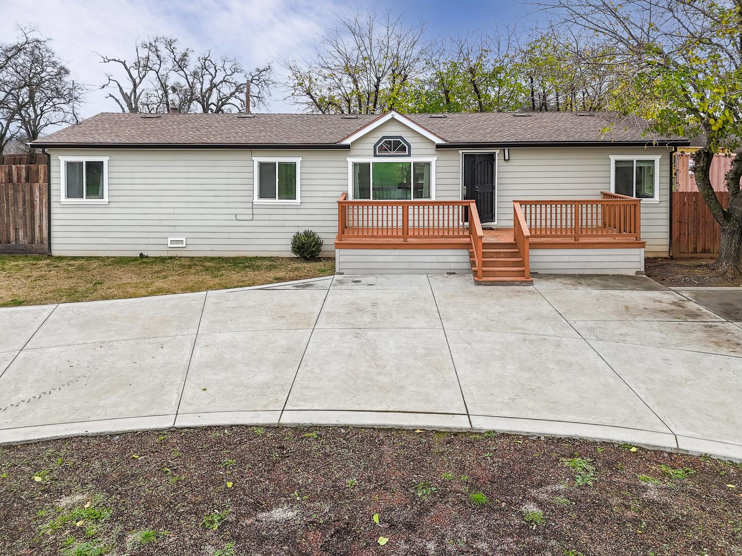 a house view with a backyard space