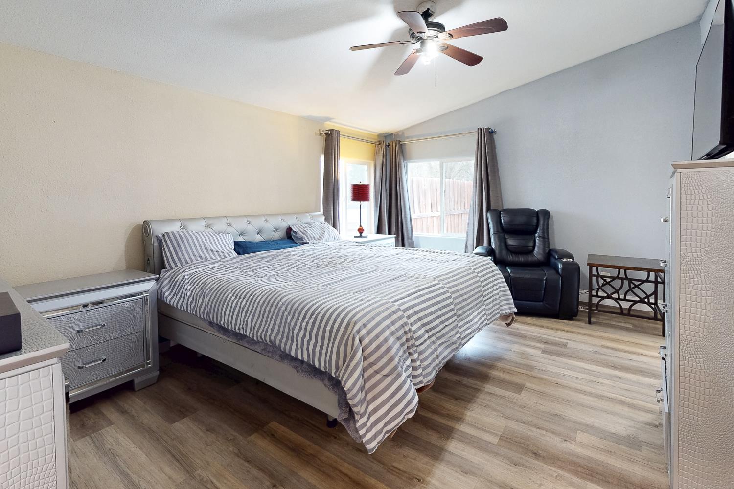 3453 La Porte Road Marysville, CA 95901 - Photo 25 of 81 a bedroom with a large bed and a chandelier