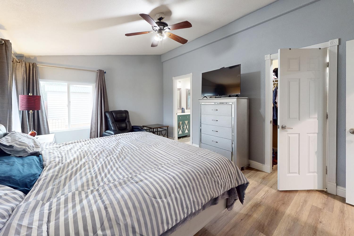 3453 La Porte Road Marysville, CA 95901 - Photo 26 of 81 a bedroom with a bed and a flat screen tv