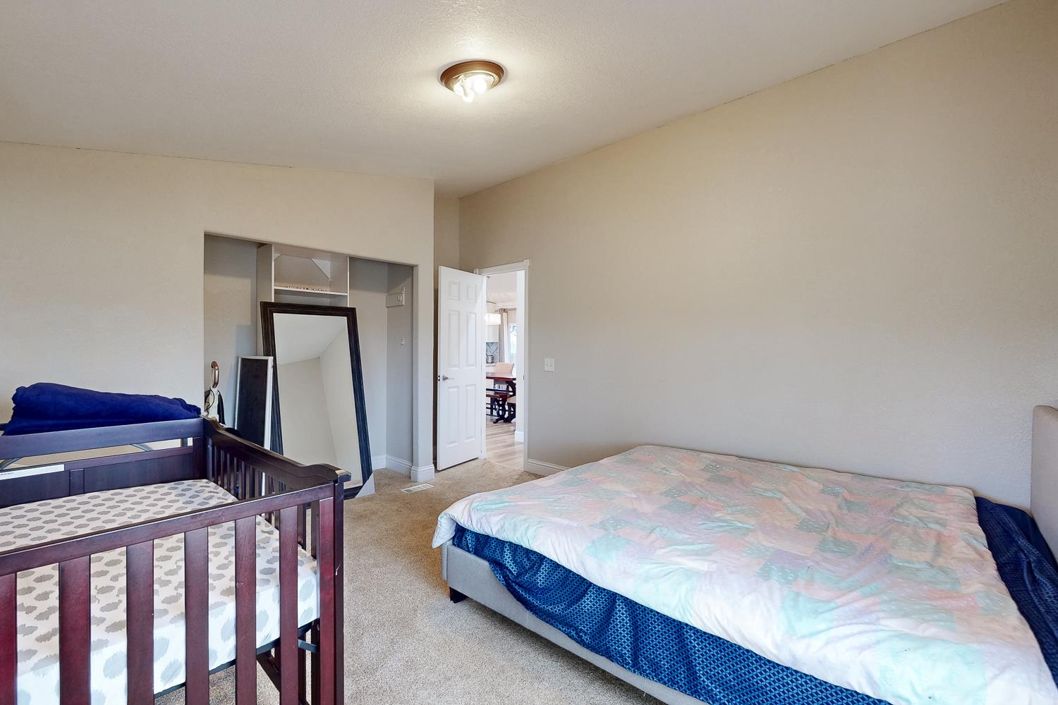3453 La Porte Road Marysville, CA 95901 - Photo 34 of 81 a bedroom with a bed and a flat tv screen on a dresser