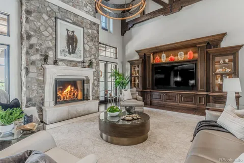 a kitchen with stainless steel appliances granite countertop a kitchen island hardwood floor and a sink