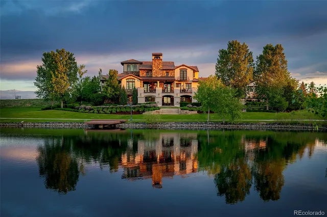 a view of a lake with a house in the background