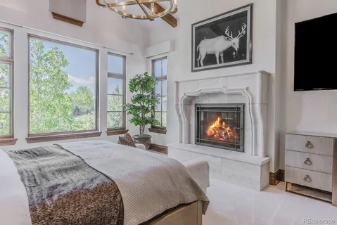a view of a bathroom with a granite countertop tub a sink and a large mirror