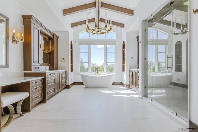 a bathroom with a bathtub and a window