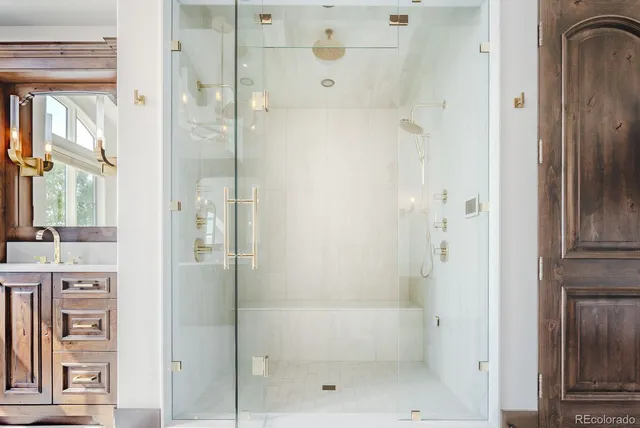 a living room with furniture a window and a chandelier