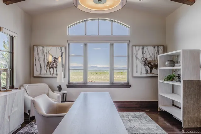 a view of kitchen island with granite countertop furniture and a wooden floor