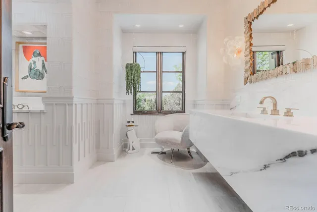 a bathroom with a bathtub and a sink