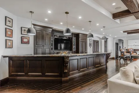 a living room with furniture a table and chairs