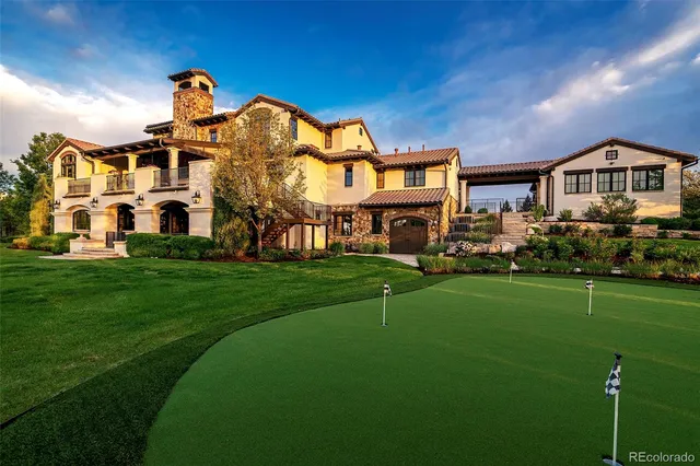 a front view of a residential apartment building with a yard