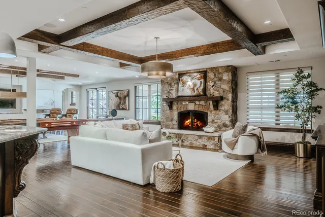 a living room with lots of furniture and kitchen view