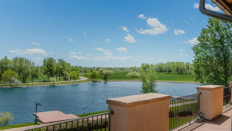 a table and chairs with an umbrella in the backyard