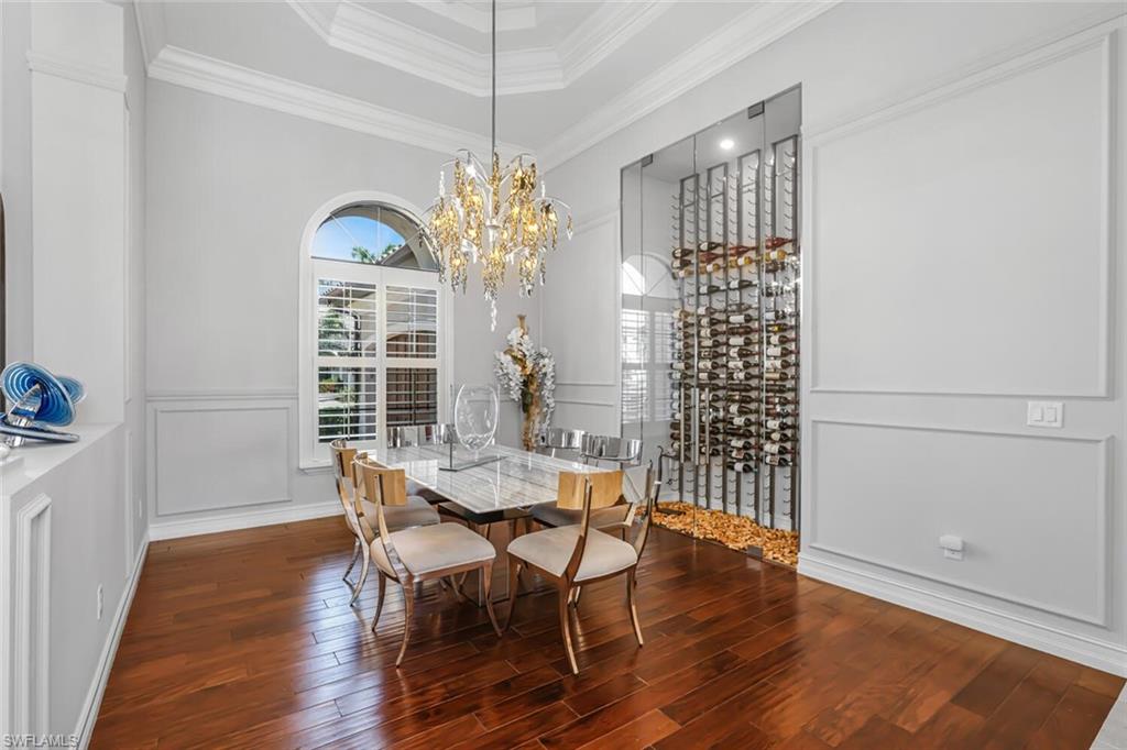 6624 Barbera Lane Naples, FL 34113 - Photo 16 of 50 a view of a dining room with furniture window and wooden floor