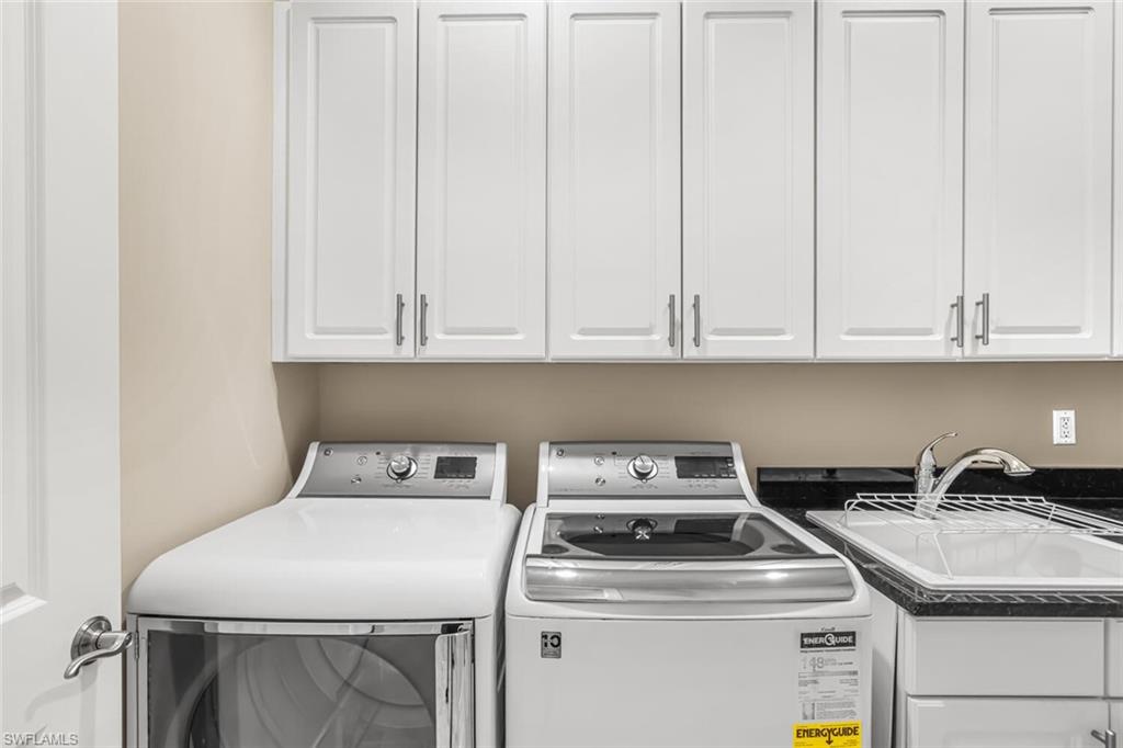6624 Barbera Lane Naples, FL 34113 - Photo 34 of 50 a utility room with dryer and washer