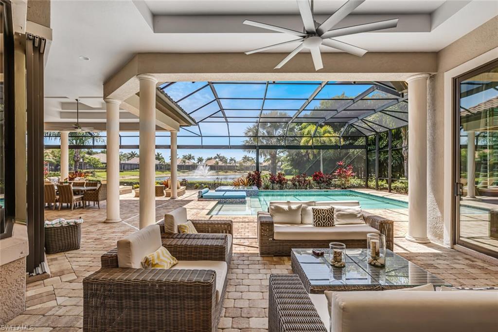 6624 Barbera Lane Naples, FL 34113 - Photo 35 of 50 a living room filled with furniture and a table