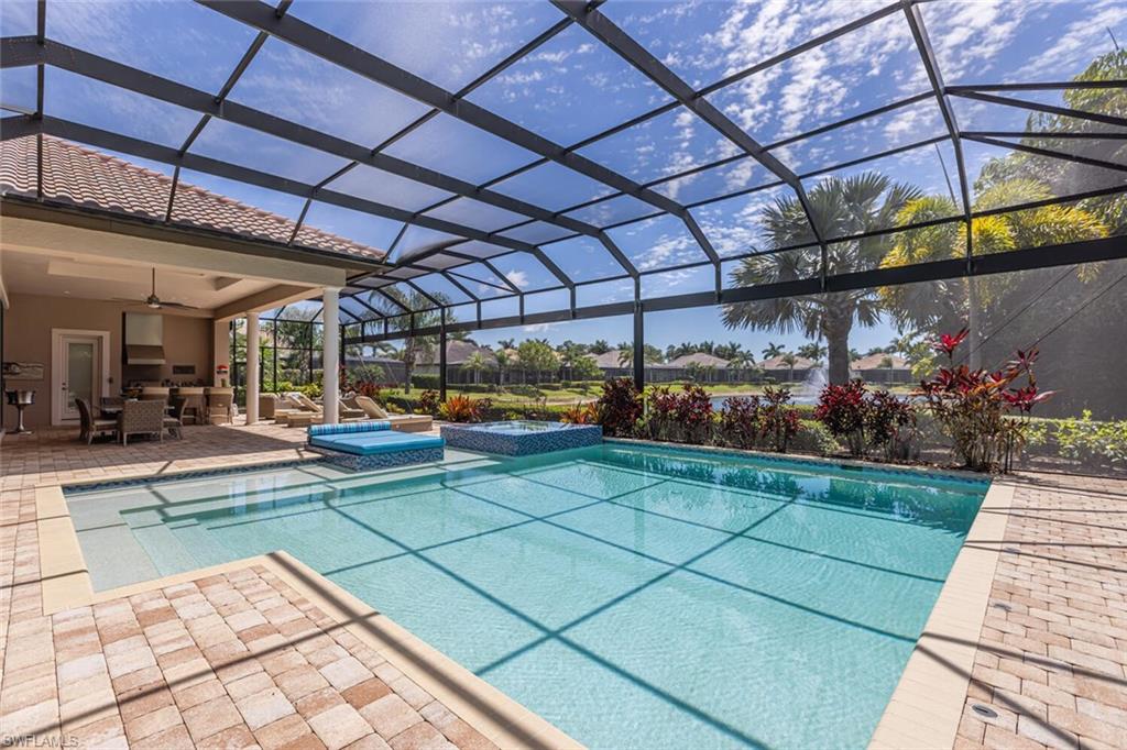 6624 Barbera Lane Naples, FL 34113 - Photo 43 of 50 a view of a backyard with sitting area