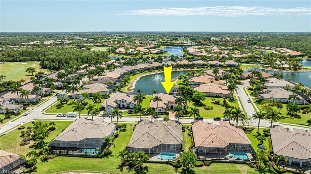 6624 Barbera Lane Naples, FL 34113 - Photo 46 of 50 an aerial view of residential houses with outdoor space and trees