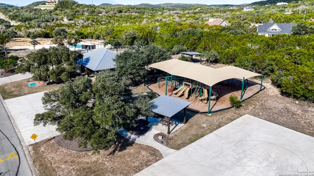 an aerial view of a house with a yard