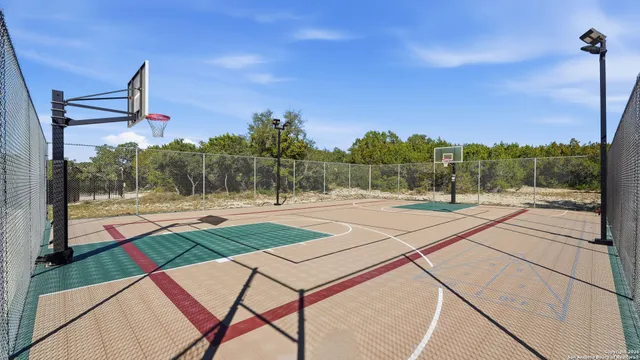 a view of outdoor space with swimming pool and trees