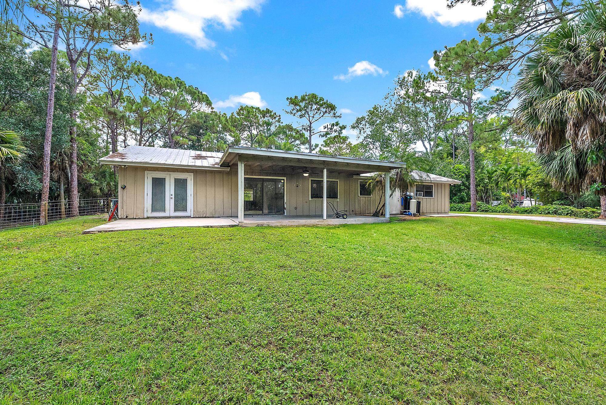 18222 126th Terrace North Jupiter, FL 33478 - Photo 14 of 22 a view of a house with a backyard