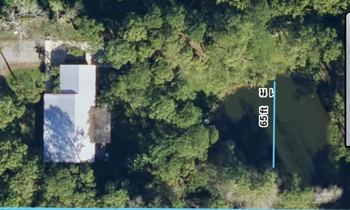 18222 126th Terrace North Jupiter, FL 33478 - Photo 19 of 22 an aerial view of a house yard and outdoor space