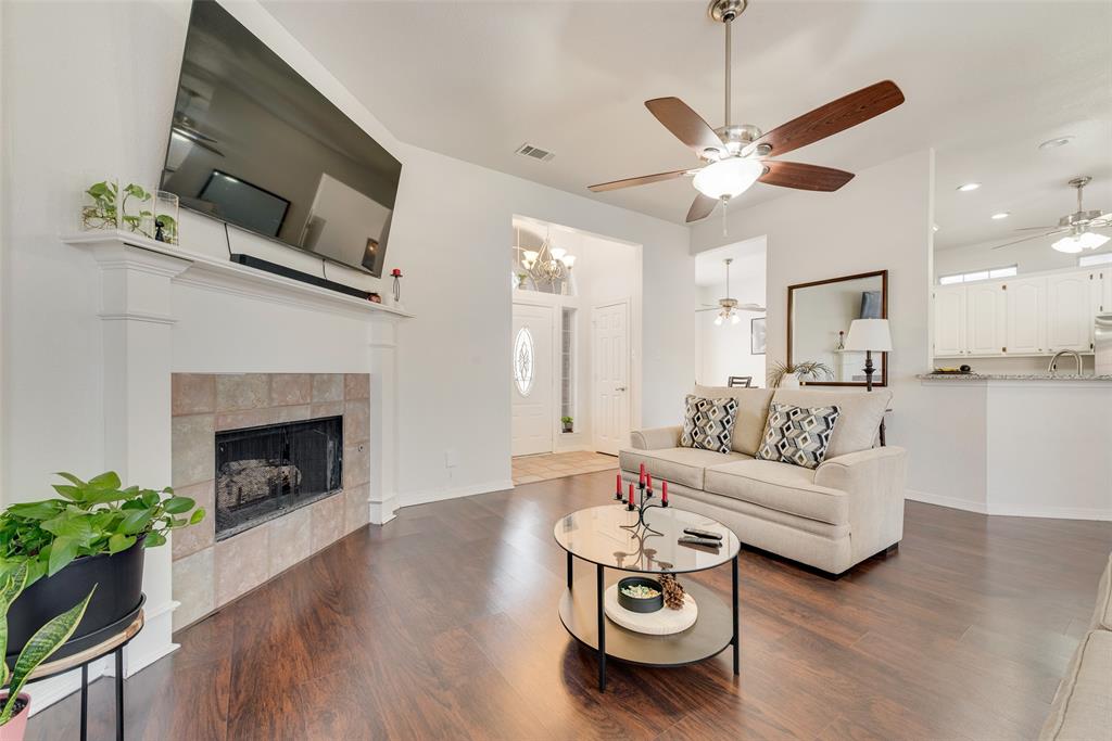 106 Villanova Circle Forney, TX 75126 - Photo 1 of 26 a living room with furniture and a fireplace