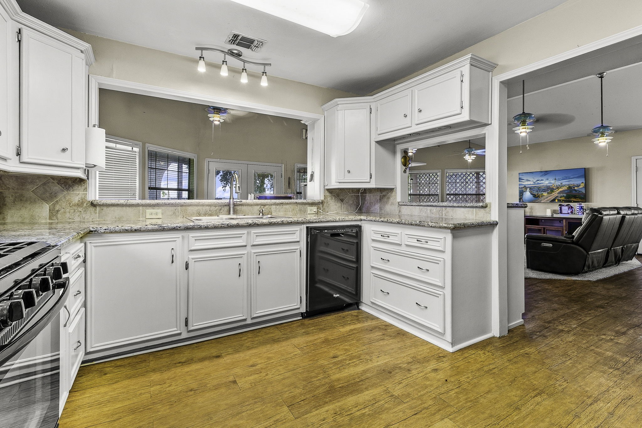 536 Weavers Cove Road Livingston, TX 77351 - Photo 11 of 44 a kitchen with a stove a sink and a refrigerator