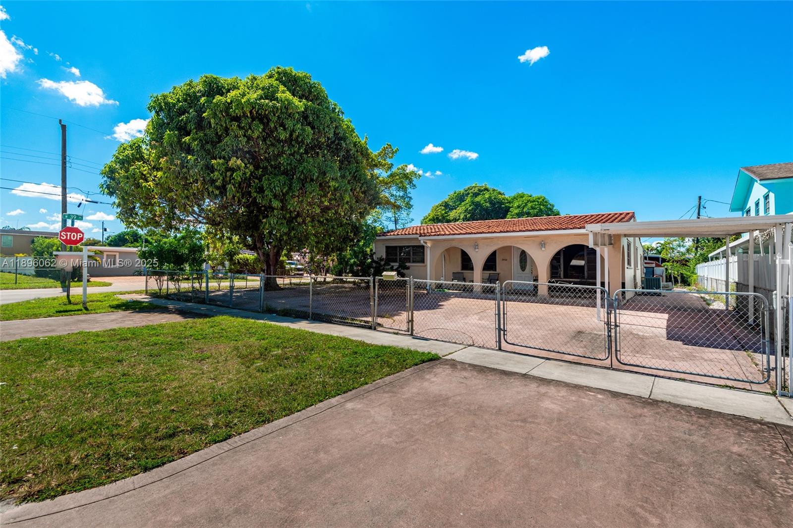 a view of house with garden and parking