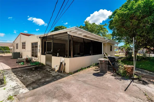 a kitchen with cabinets appliances and a sink