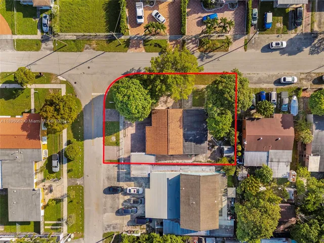 an aerial view of a house with a ocean view