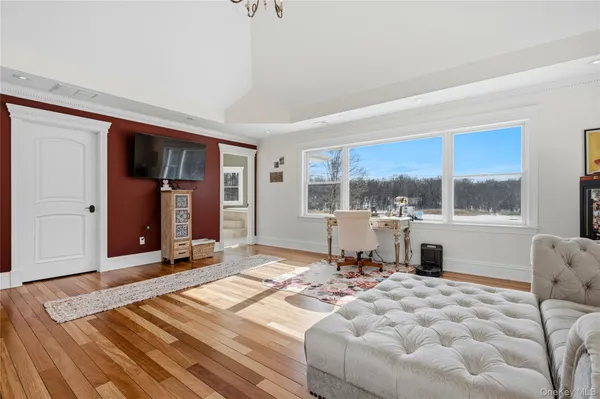 a bedroom with a bed and a couch