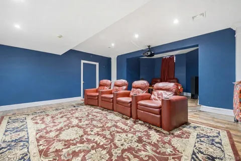 a bedroom with bed and wooden floor