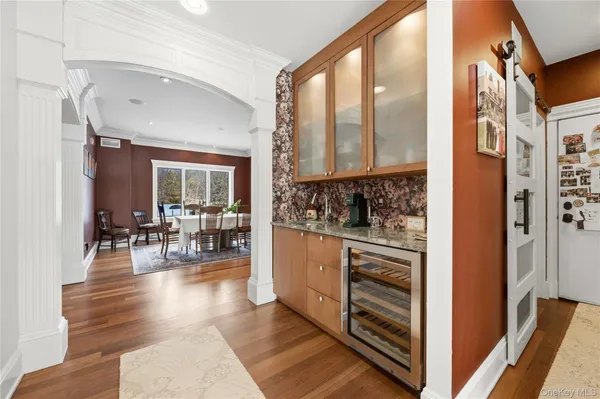 a dining room with furniture and wooden floor