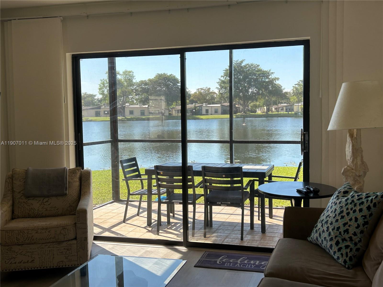 200 Berkley Road, Unit 113 Hollywood, FL 33024 - Photo 11 of 38 a building outdoor space with patio furniture