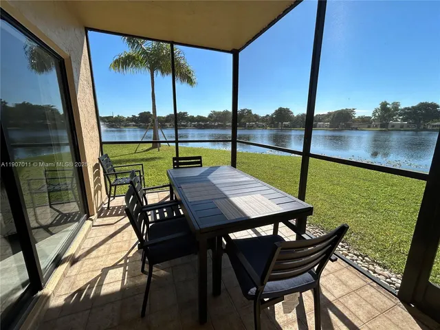 a view of an outdoor sitting area with furniture