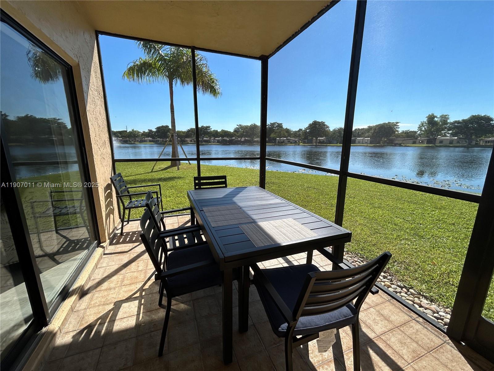 200 Berkley Road, Unit 113 Hollywood, FL 33024 - Photo 13 of 38 a view of an outdoor sitting area with furniture
