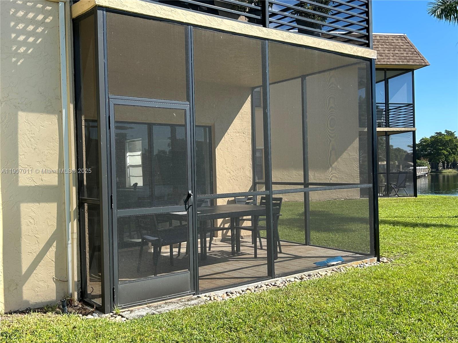 200 Berkley Road, Unit 113 Hollywood, FL 33024 - Photo 16 of 38 a view of an outdoor space and yard