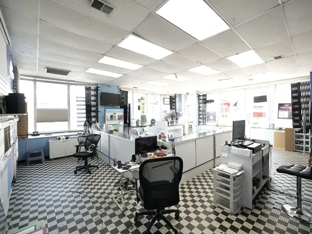 a bathroom with a granite countertop sink a vanity and shower