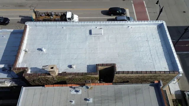 a kitchen with refrigerator and window