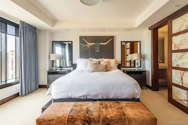 a large bathroom with a sink a large mirror and a shower