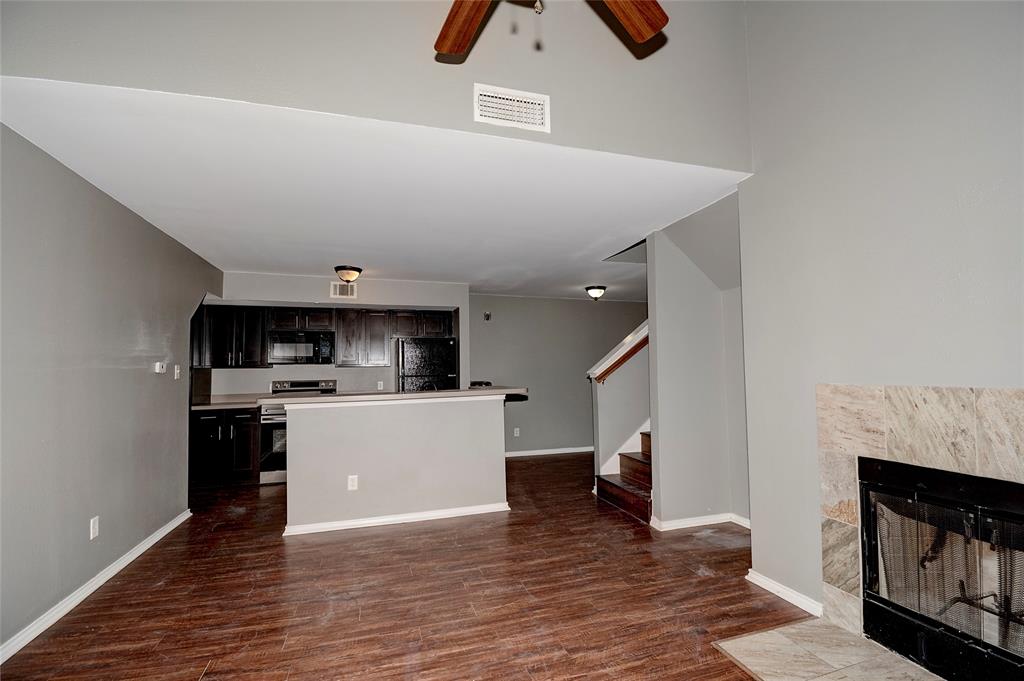 9831 Walnut Street, Unit 209 Dallas, TX 75243 - Photo 20 of 26 a living room with furniture and a fireplace