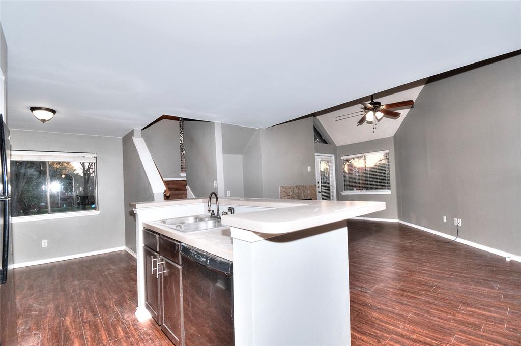 9831 Walnut Street, Unit 209 Dallas, TX 75243 - Photo 21 of 26 a kitchen with a sink cabinets and wooden floor
