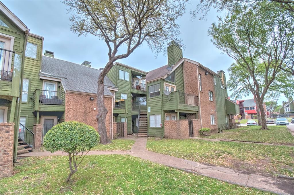 9831 Walnut Street, Unit 209 Dallas, TX 75243 - Photo 25 of 26 a front view of a house with garden