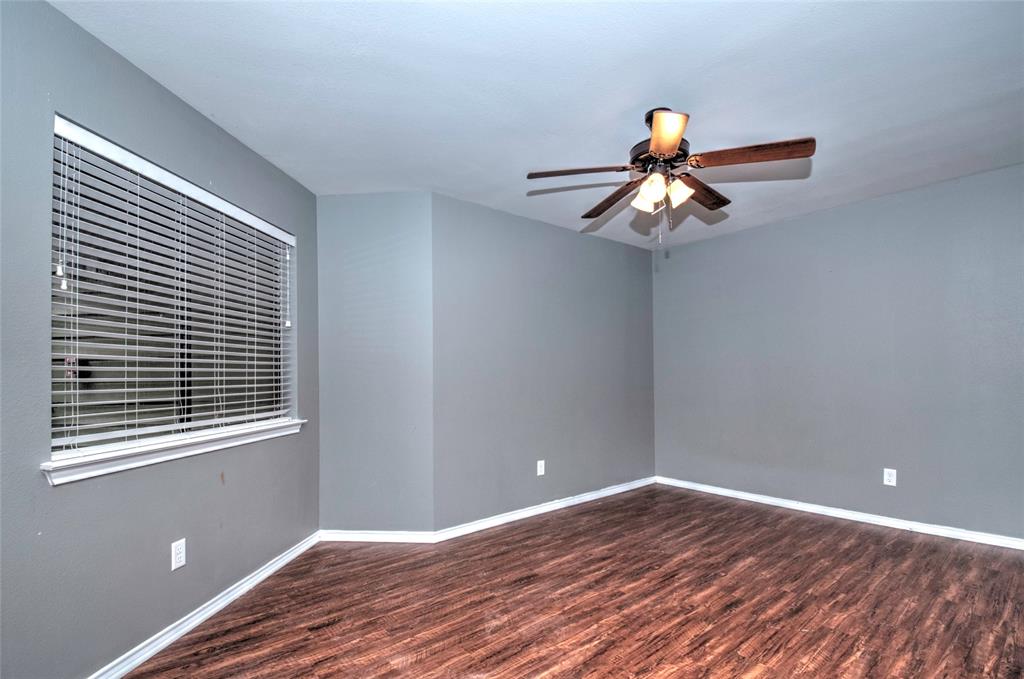 9831 Walnut Street, Unit 209 Dallas, TX 75243 - Photo 6 of 26 a bedroom with a bed and a window