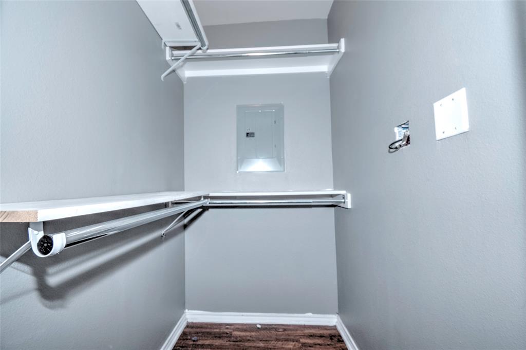 9831 Walnut Street, Unit 209 Dallas, TX 75243 - Photo 9 of 26 a view of a room with rack on the wall