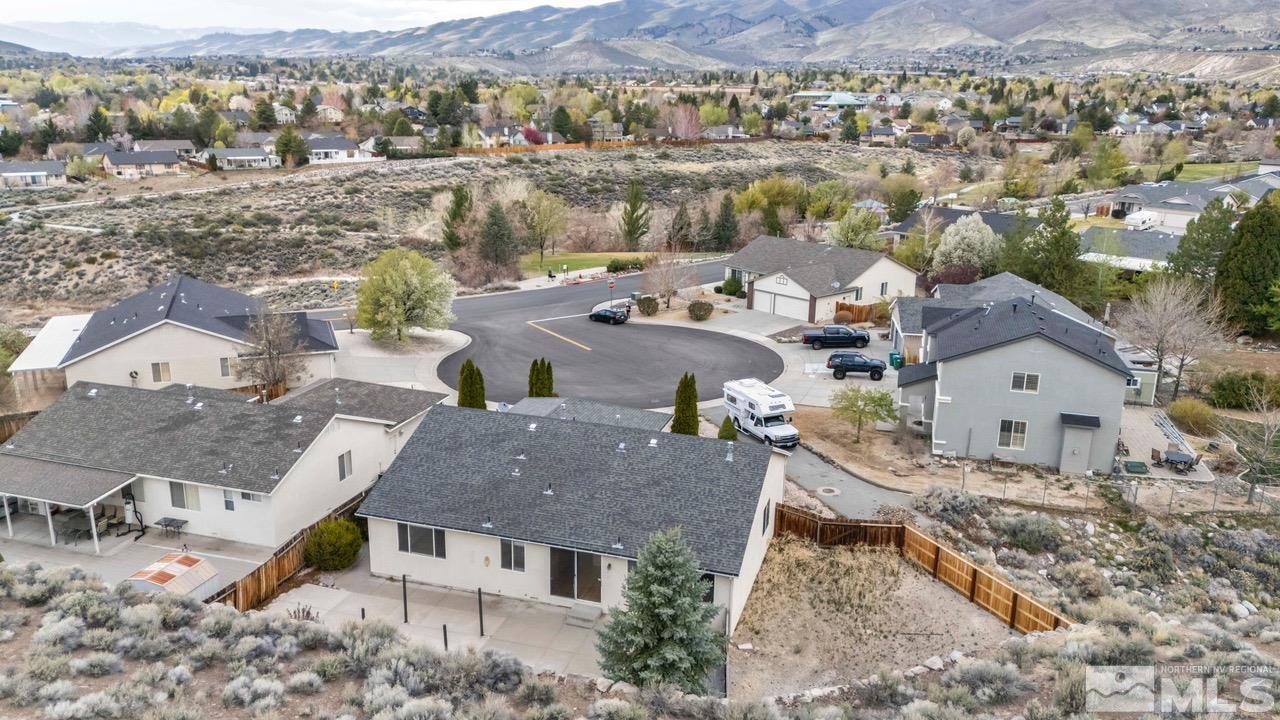 5458 Zeppelin Court Reno, NV 89523 - Photo 14 of 36 an aerial view of a house with a yard and mountain view