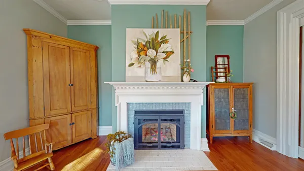 a bed room with a bed and a chair