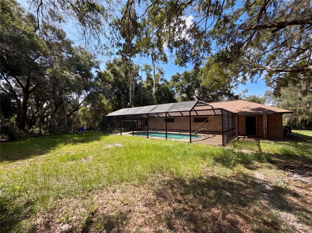 3739 Lake Griffin Road Lady Lake, FL 32159 - Photo 5 of 21 a view of a house with a yard and sitting area