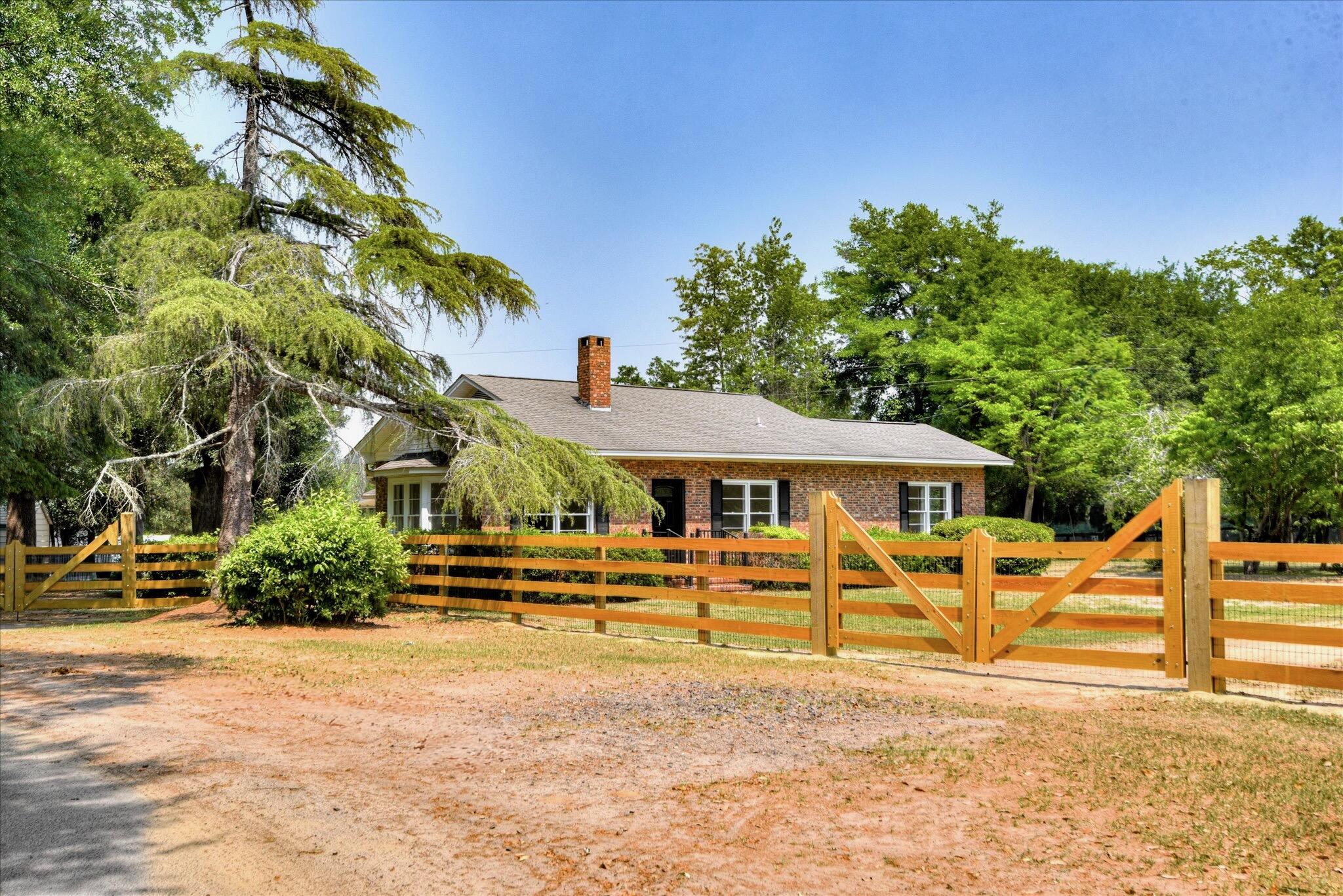 126 Mosley Road Aiken, SC 29801 - Photo 1 of 29 a front view of a house with a yard