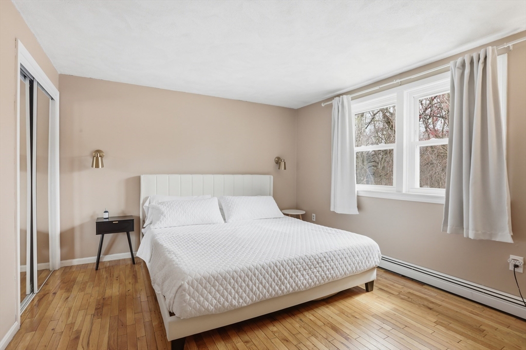 24 Clark Street Salem, MA 01970 - Photo 12 of 38 a bedroom with a bed and a window